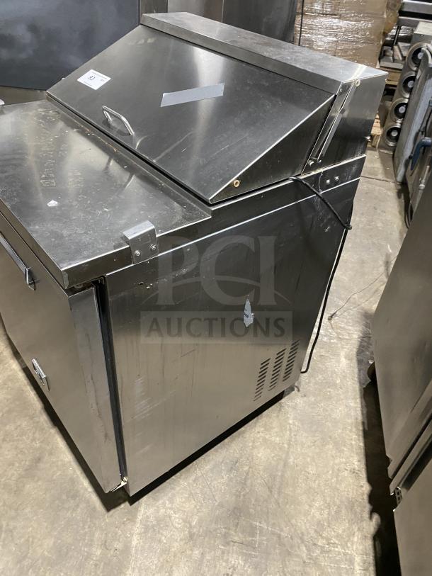 Kelvinator stainless steel refrigerated prep table, model KCHST278, on casters, includes wired rack, good condition.