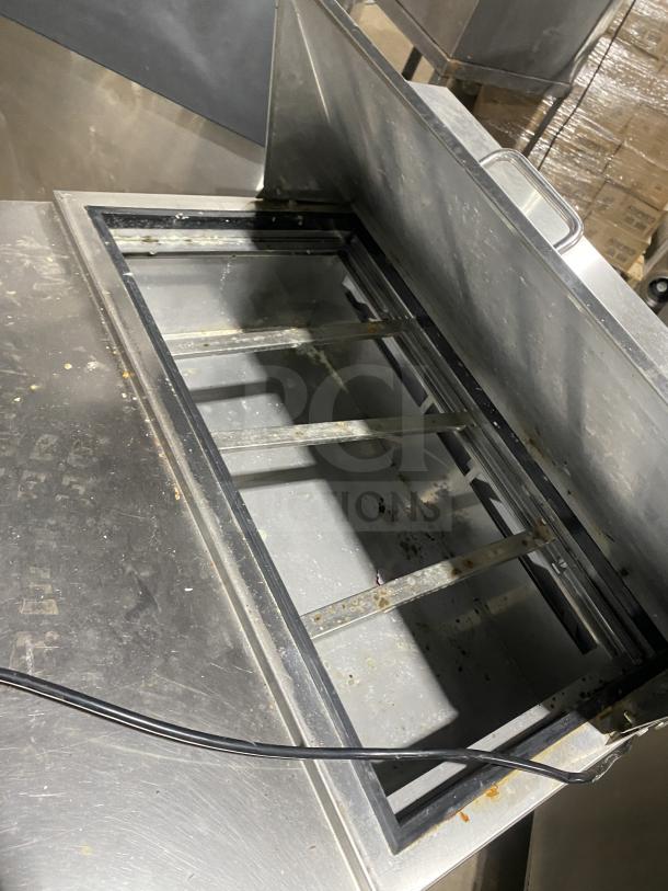 Kelvinator stainless steel single door refrigerated prep table, model KCHST278, with wired rack and casters.