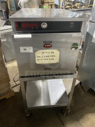 FWE Handy Line Commercial Stainless Steel 4-Pan Heated Holding Cabinet on Stand, Model HLC-1826-4-UC, 120V, with casters.