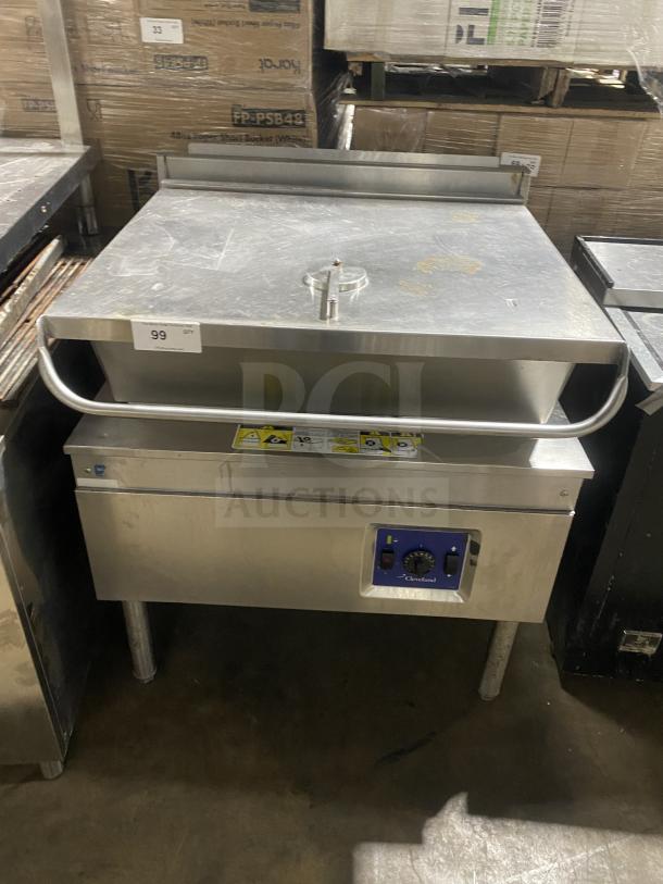 Cleveland commercial stainless steel gas-powered ultra tilt skillet on legs, features control panel and safety markings.