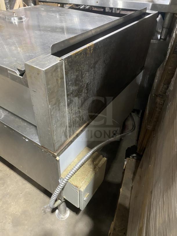 Cleveland commercial stainless steel gas-powered ultra tilt skillet with tilted braising pan on legs. Used condition.