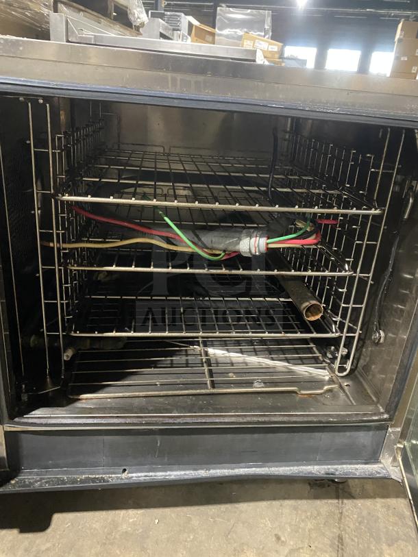 Electrolux Air-O-Convect Series combi oven with Touchline controls, stainless steel, natural gas, wired oven rack, on legs.