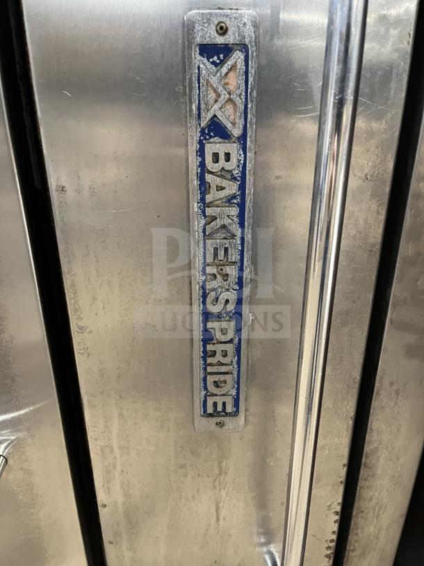 Bakers Pride Y600/602 stainless steel pizza oven, double-stacked, gas-powered. Features brand logo label.