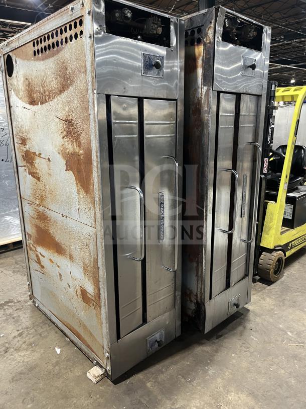 Bakers Pride Y600/602 stainless steel gas pizza oven, double stacked, 6 pie capacity, visible wear and rust, commercial use.