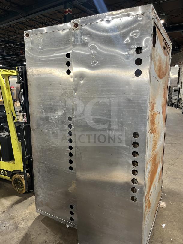 Bakers Pride Y600/602 double-stacked pizza oven, stainless steel, gas-powered, visible rust and wear, auction item.