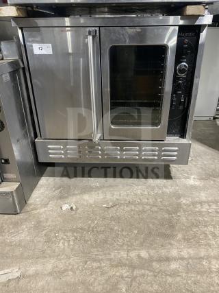 Majestic Series stainless steel single stack convection oven, wired racks, good condition, visible control panel and door label.