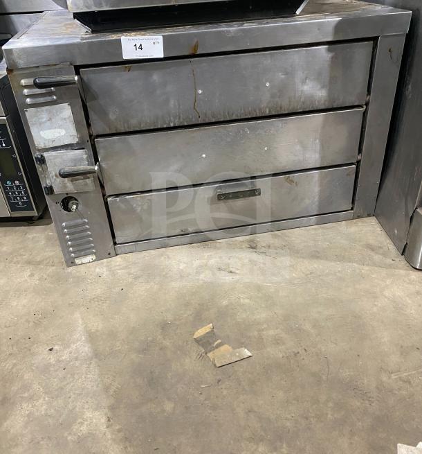 Bakers Pride GP-61 commercial countertop stainless steel pizza oven with dual baking chambers, natural gas powered.