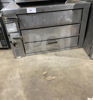 Bakers Pride GP-61 commercial countertop stainless steel pizza oven with dual baking chambers, natural gas powered.
