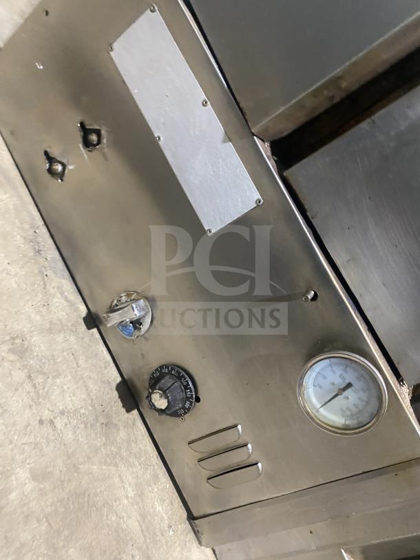 BARI stainless steel gas pizza oven model 648, serial 2267, control panel view. Features dials and thermostat gauge.