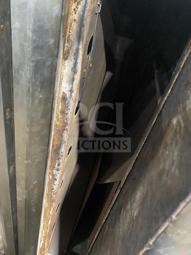 Bari Model 648 stainless steel double-stacked pizza oven, gas-powered. Visible wear and rust on surface.