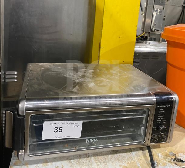 Ninja Countertop Digital Air Fry Oven, Model FT102CO, with view-through door and control panel. Used condition. 120V.