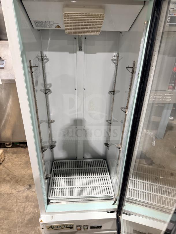 Avantco glass door reach-in cooler merchandiser, model 178GDC10HCW, with poly-coated racks, in used condition.
