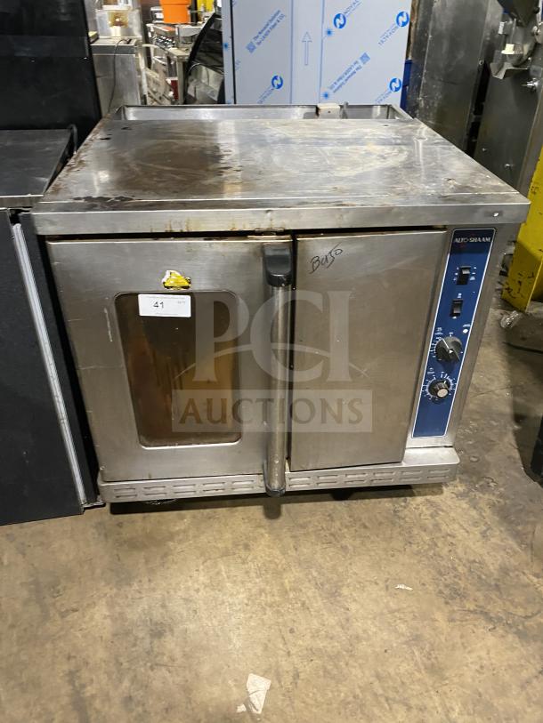 Alto-Shaam stainless steel natural gas oven with wired rack, SN: 710358-002, on casters; 110-115V, used condition.