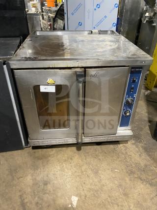 Alto-Shaam stainless steel natural gas oven with wired rack, SN: 710358-002, on casters; 110-115V, used condition.