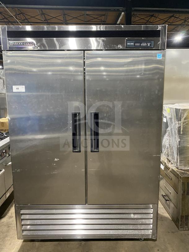 Maxx Cold 2-door stainless steel commercial refrigerator MCR-49FDHC-V1, poly coated racks, on casters, model and serial tags visible.