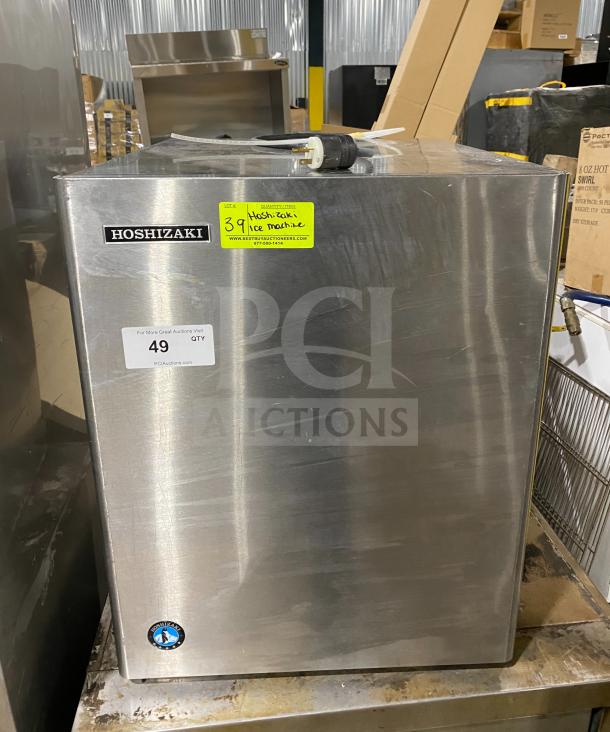 Hoshizaki KM-660MRJ commercial ice maker, stainless steel, electric powered, 115V 1 phase, model and serial number visible.