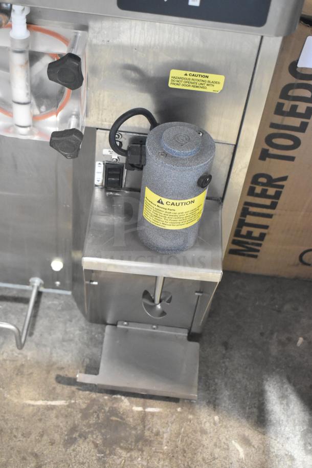 Stoelting F131-38I2-SAMS 2-flavor soft serve machine, with drink mixing attachment, 208/240V, 1 phase, caution labels visible.