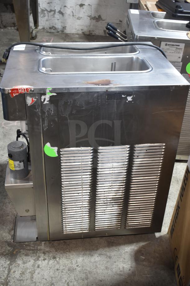 Stoelting F131-38I2-SAMS countertop 2-flavor soft serve machine with twist and drink mixer, 208/240V, visible wear and labels.
