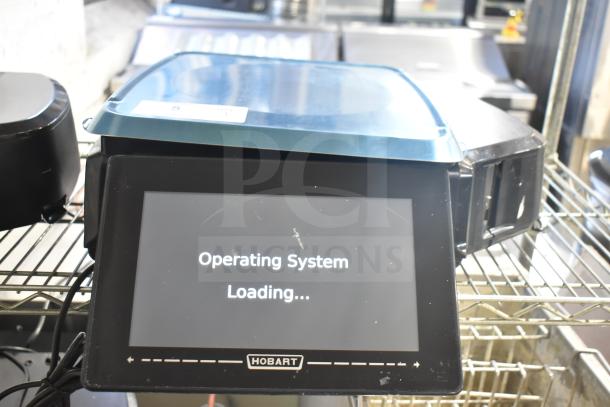 2025 Hobart HTi-7LH4W commercial countertop food portioning scale, 120/208-240V, 1 phase, with touchscreen displaying "Operating System Loading."