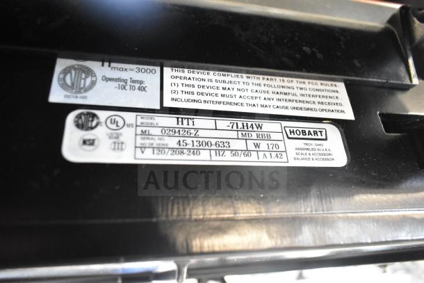 2025 Hobart HTi-7LH4W commercial scale label showing model details, voltage, phase specifications, and UL listing.