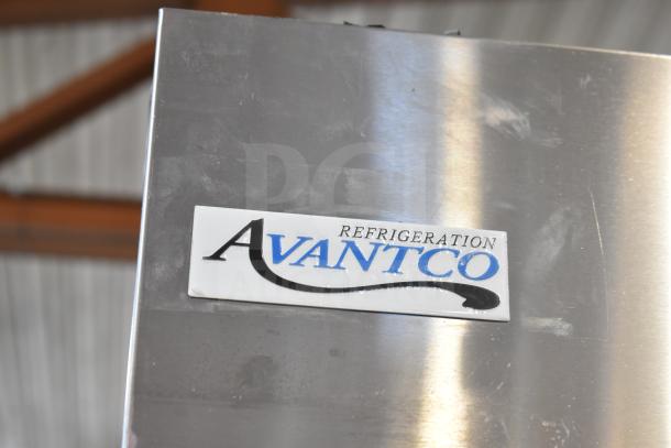 Avantco 447AP49R cooler label, indicating brand and model on stainless steel surface. Scratches visible, commercial use.