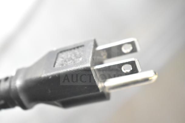 Close-up of a power plug for a 2025 Avantco 178SSUC60FHC commercial freezer, indicating electrical specifications.