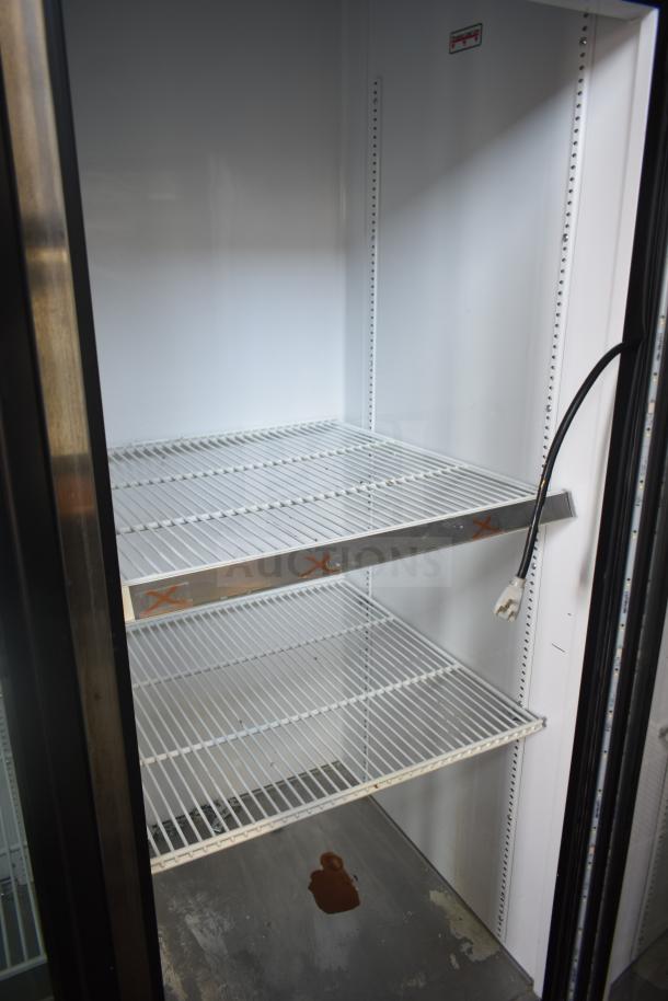 2017 True GDM-72-LD 3 Door Reach-In Cooler, commercial use, white interior, wire shelves, 115/208-230V, 1 phase.