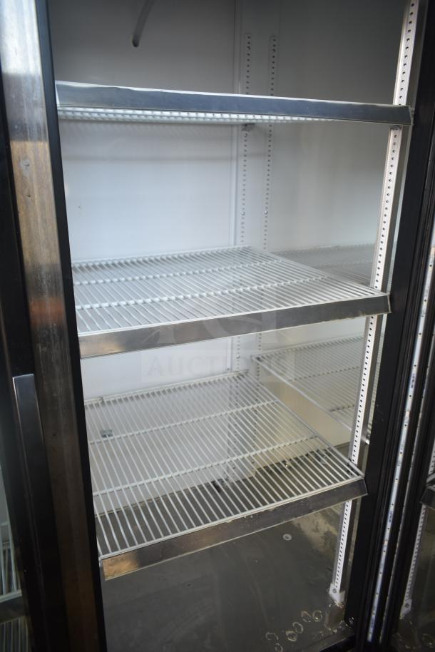 2017 True GDM-72-LD commercial 3-door cooler, white interior, adjustable shelves, 115/208-230V, 1 phase.