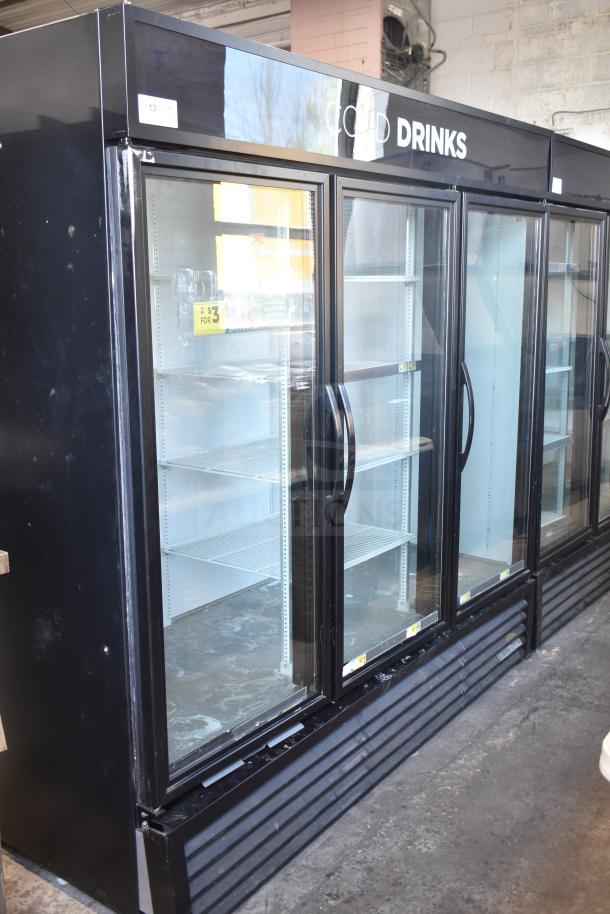 2018 True GDM-72-LD commercial 3-door cooler, glass front, black exterior, shelving included, 115/208-230V, 1-phase.