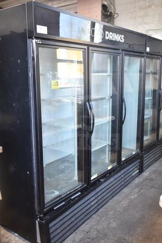 2018 True GDM-72-LD commercial 3-door cooler, glass front, black exterior, shelving included, 115/208-230V, 1-phase.