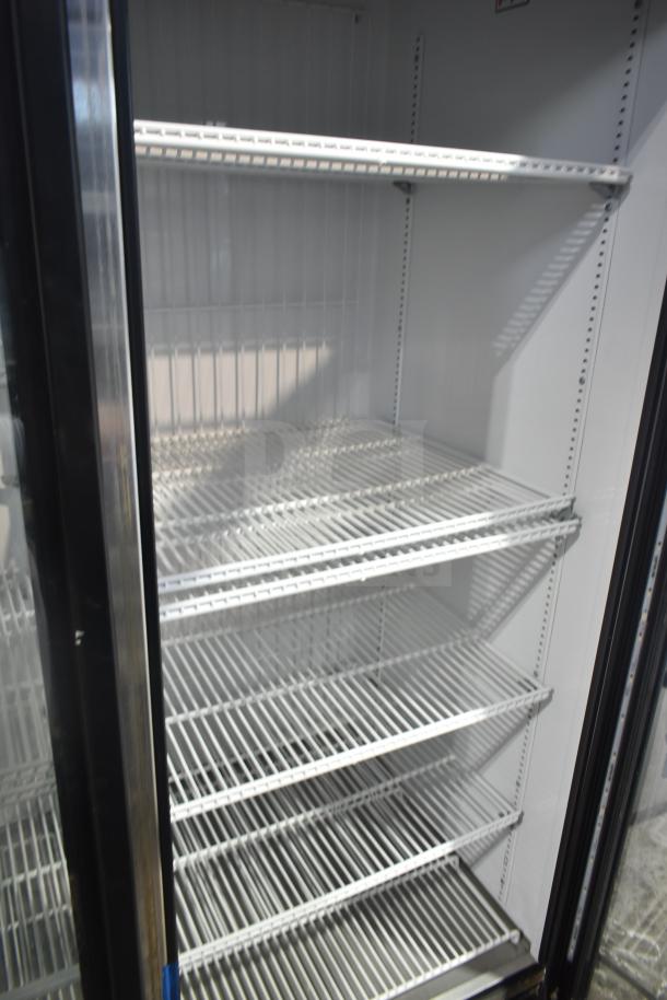 2018 True GDM-72F-LD commercial freezer with three glass doors, white interior, five adjustable shelves. Suitable for 115/208-230V.