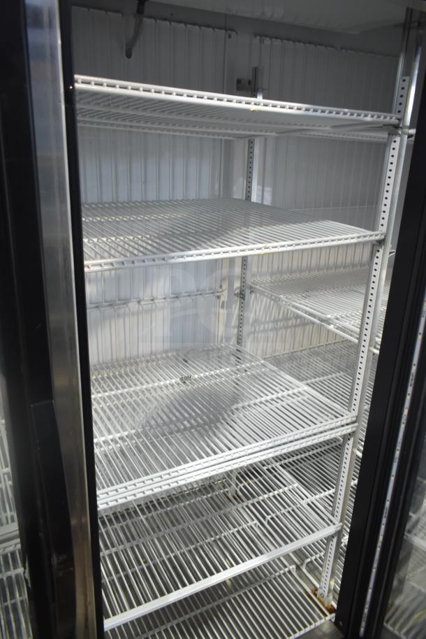 2018 True GDM-72F-LD Commercial 3 Door Reach In Freezer, clean shelves, metal frame, 115/208-230V, 1 Phase.