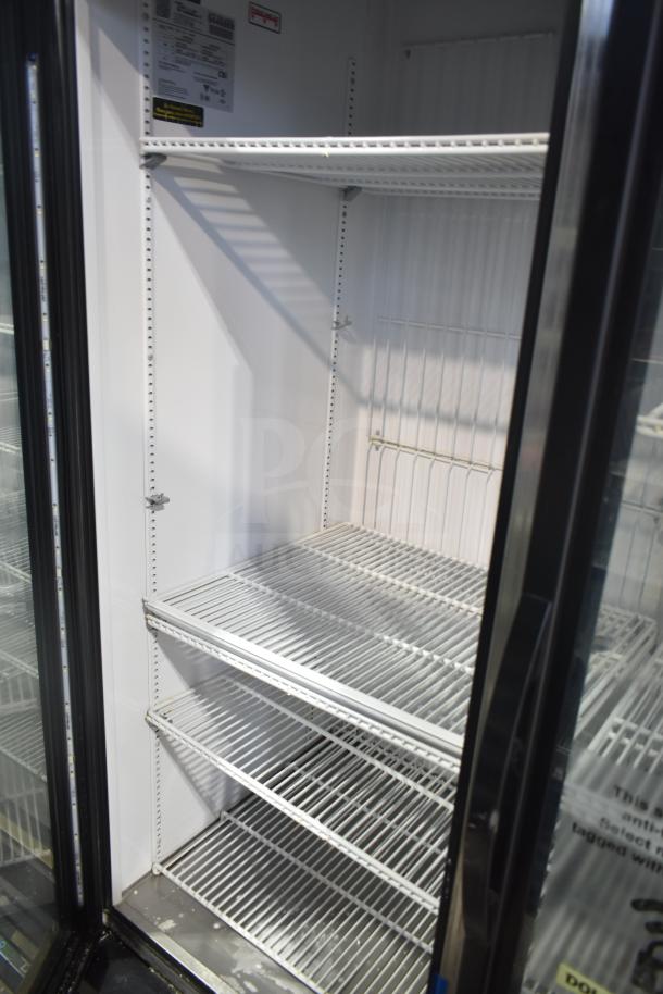 2018 True GDM-72F-LD commercial 3-door freezer merchandiser, 115/208-230V, 1 phase, with wire shelving and interior light.