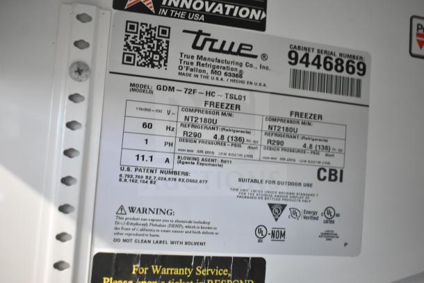 Label for True GDM-72F-LD freezer showing model, voltage, refrigerant type, and serial number. Suitable for outdoor use.