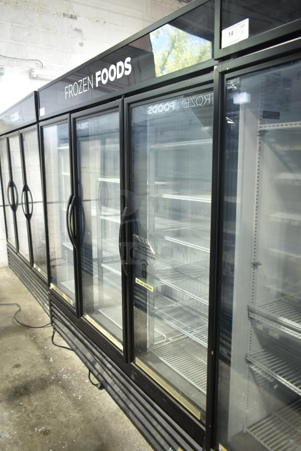 2018 True GDM-72F-LD Commercial 3 Door Freezer Merchandiser, glass doors, shelves, "Frozen Foods" signage, used condition.