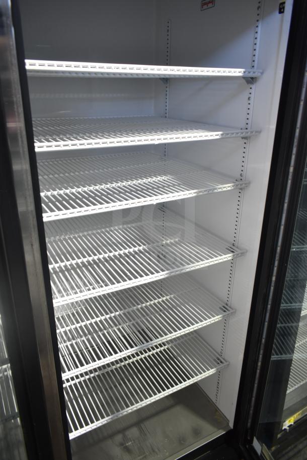 2018 True GDM-72-LD Commercial 3 Door Cooler, 115 Volts, 1 Phase, 6 adjustable shelves, glass doors, excellent condition.