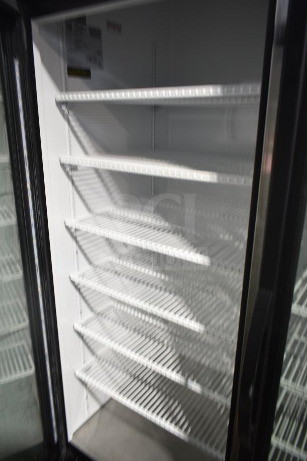 2018 True GDM-72-LD commercial cooler, 3 glass doors, multiple shelves, 115 volts, ideal for merchandising, clean interior.