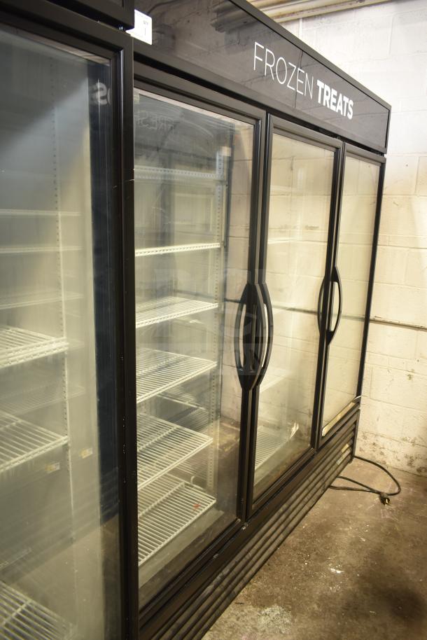 2018 True GDM-72F-LD commercial 3-door freezer merchandiser, glass doors, 115/208-230V, 1 phase, “Frozen Treats” sign.