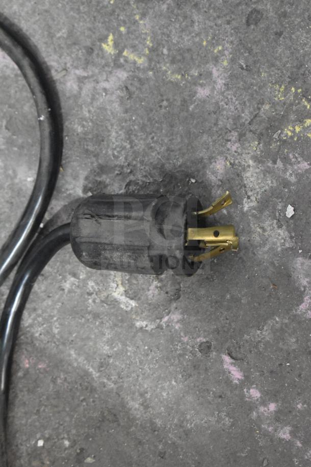 Power plug for the 2018 True GDM-72F-LD commercial freezer. Black cord with a three-prong connection.