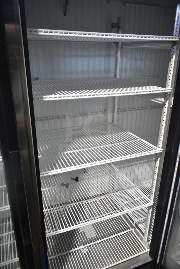 2018 True GDM-72F-LD commercial 3-door freezer with multiple shelves, reach-in style, 115/208-230V, 1 phase.