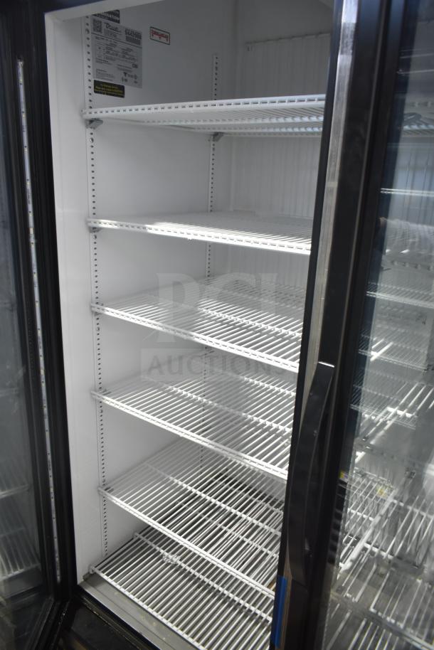 2018 True GDM-72F-LD commercial 3-door freezer, shelves visible, 115/208-230V, model tag shown, clean condition.