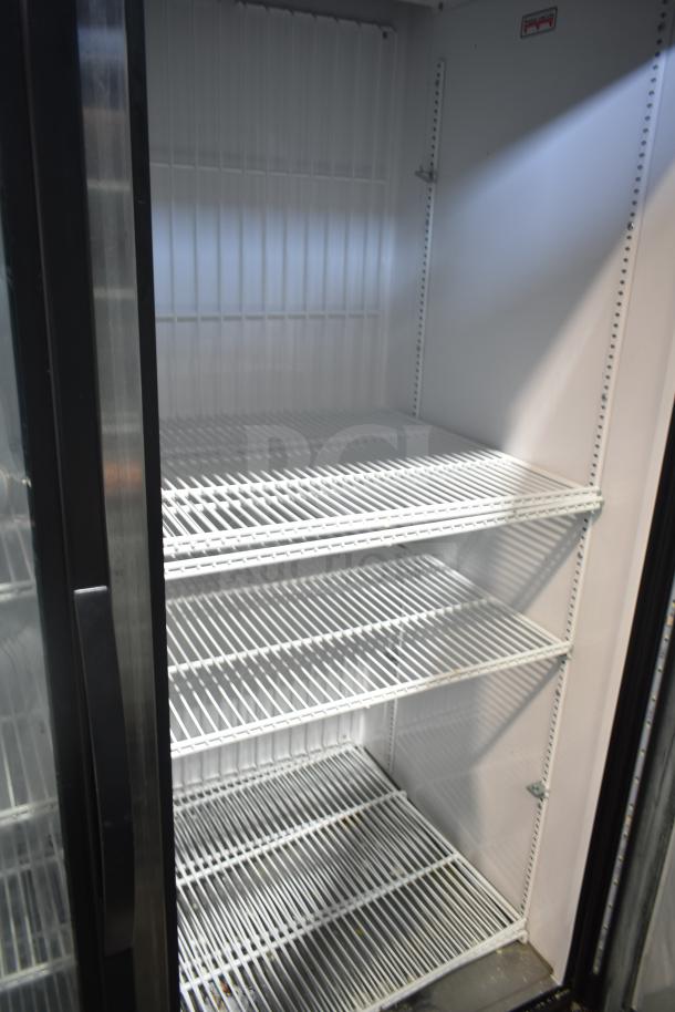2020 True GDM-49F-LD commercial freezer, 2-door, reach-in, white interior, adjustable shelves, excellent condition.