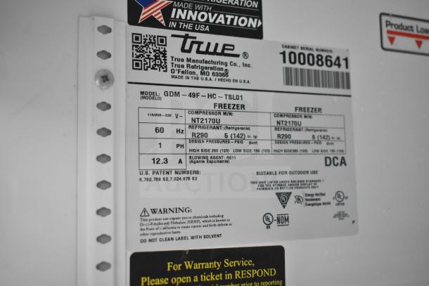 2020 True GDM-49F-LD commercial freezer label showing model, voltage, refrigerant info, and compliance marks.