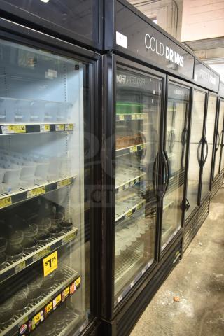 2019 True GDM-49-HC commercial 2-door cooler, 115V, 1 phase. Black frame, glass doors, interior shelving visible.