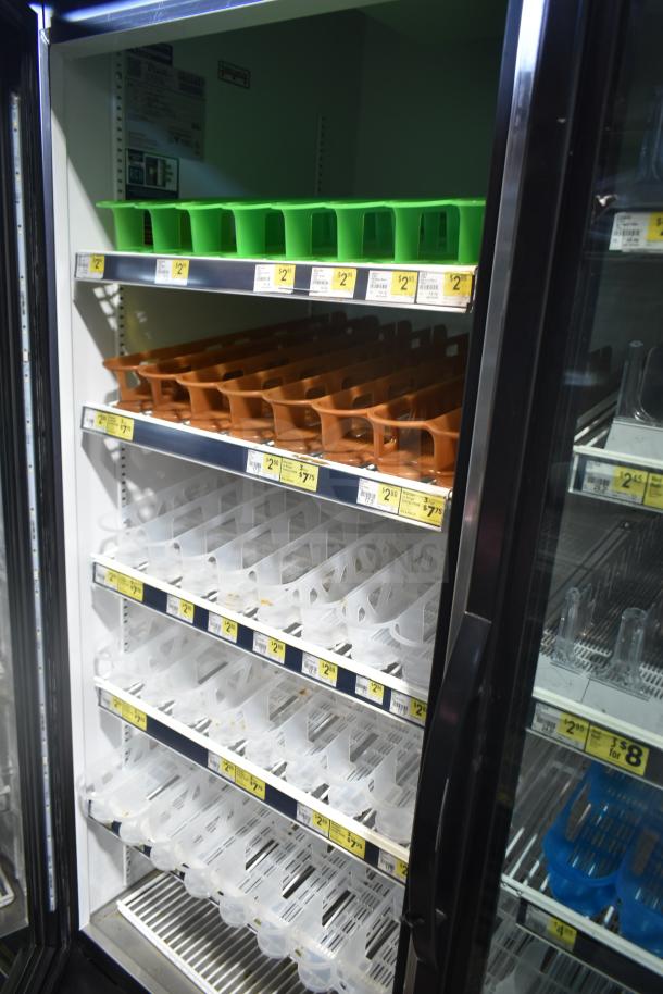 2019 True GDM-49-HC Commercial 2 Door Reach In Cooler, with shelves and color-coded trays, tags showing prices.