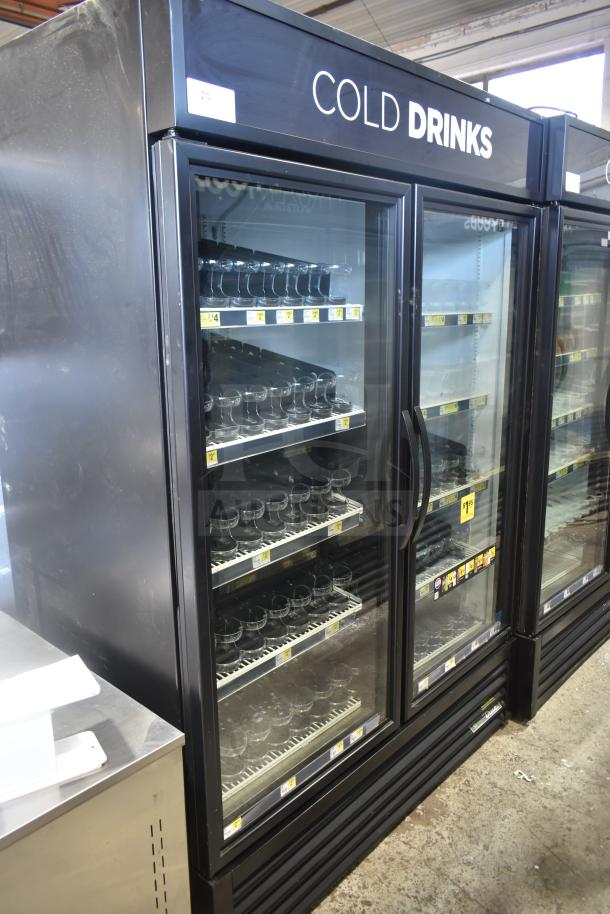 2019 True GDM-49-HC 2-door reach-in cooler, commercial use, 115 volts, 1 phase. Features glass doors and sturdy shelves.