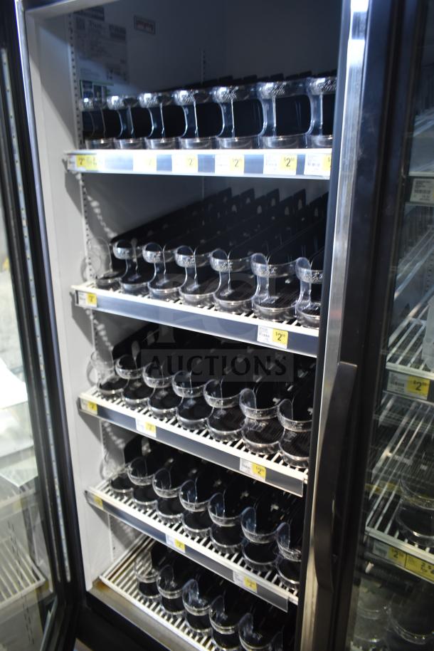 2019 True GDM-49-HC Commercial 2 Door Cooler, 115V, 1 Phase, shelves displayed with merchandise, in good condition.