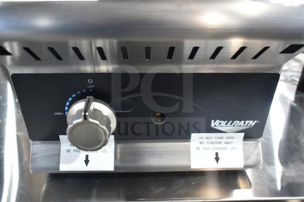 Vollrath GGMDM-12 12" countertop griddle, manual controls, 28,000 BTU, shown in pristine condition with visible control panel.