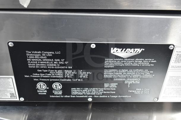 Vollrath GGMDM-12 Commercial 12" Griddle label, showing manual controls, 28,000 BTU, and model info. Serial: N319-02543874-168.