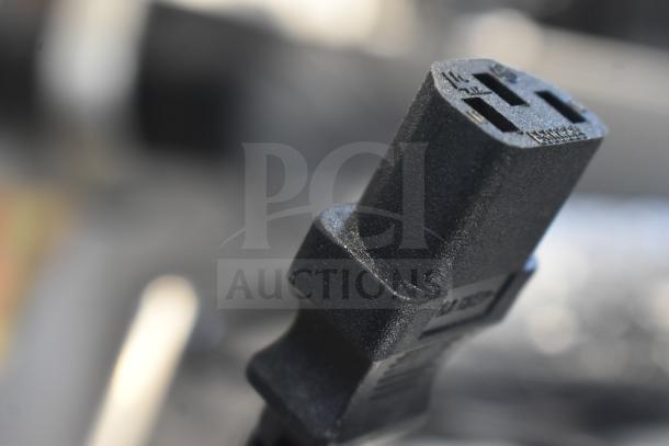Close-up of a black power plug for the AvaWeigh 334PCSP30T scale, showing prong detail.